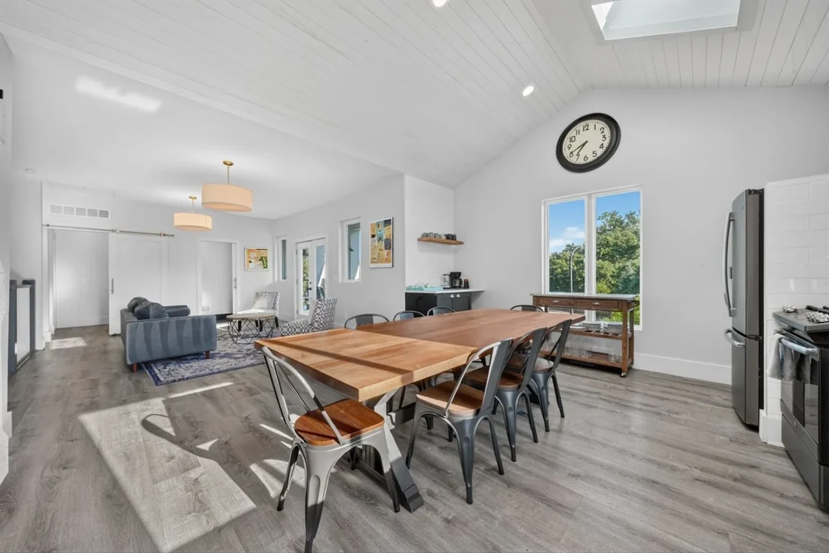 White House Retreat dining room with long table, chairs and skylight